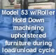 Model 53 w/Roller Hold Down machining upholstered furniture during load/unload cycle