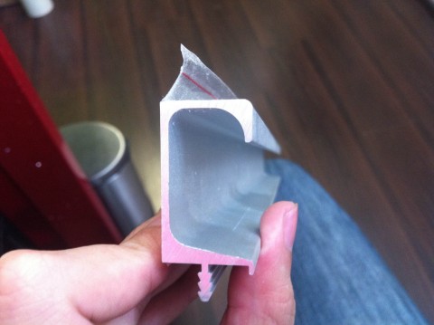 Top part is where you put your fingers and pull and bottom part is where you stick it to the door/drawer